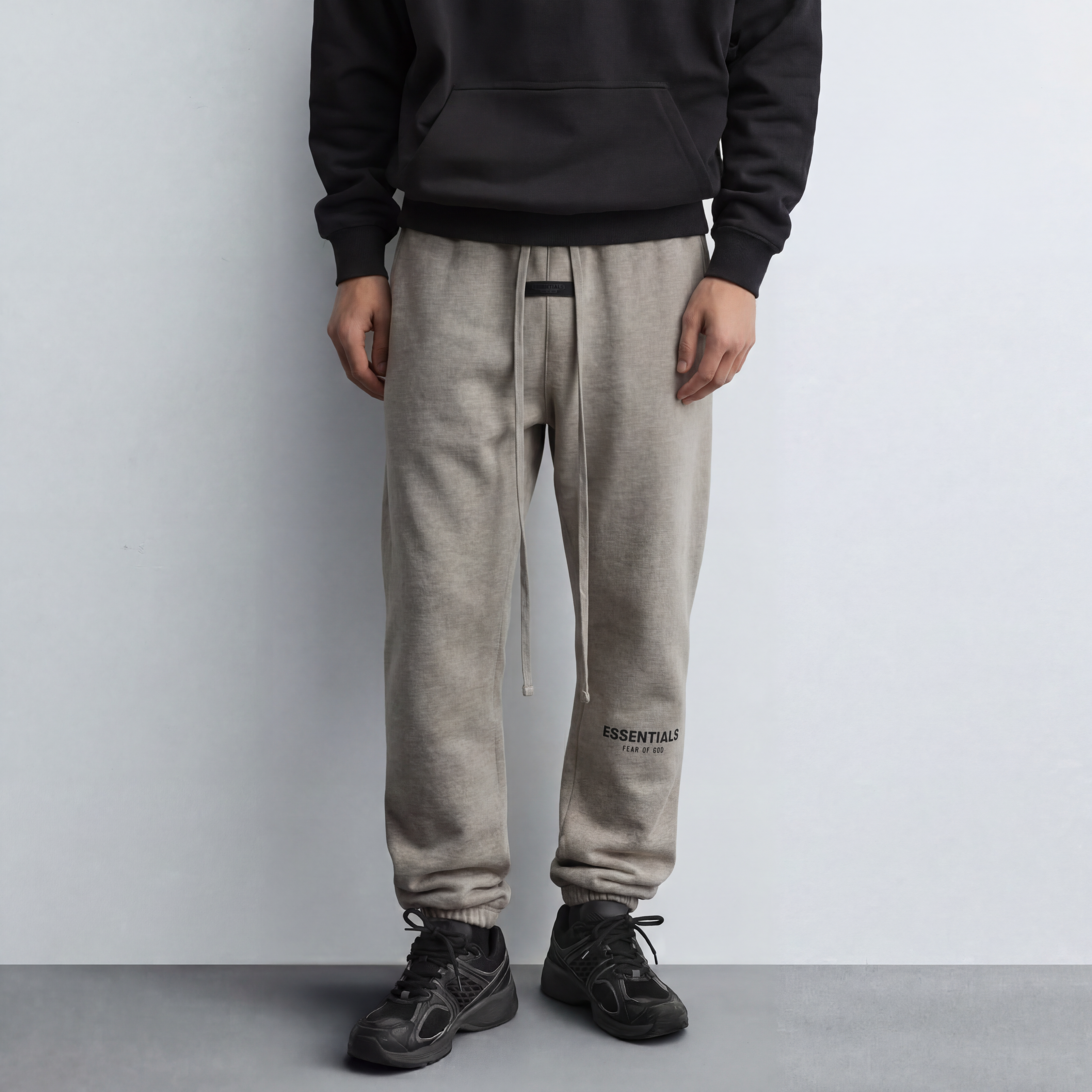 Model wearing essentials dark oatmeal sweatpants